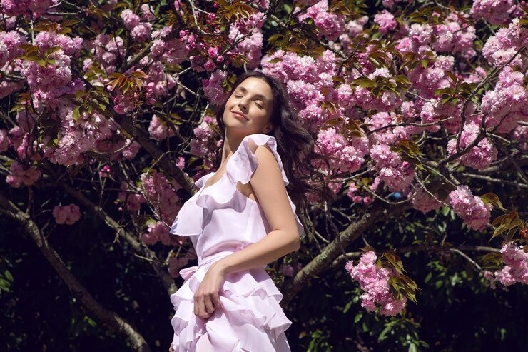 imgi_299_portrait-young-woman-standing-amidst-plants_1048944-12274991